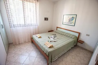 Letto o letti in una camera di Seaside happiness flat and shared pool in Rosolina
