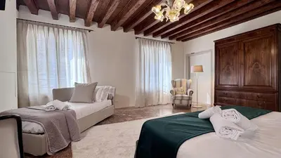 Letto o letti in una camera di Residence Vendramin Canal View