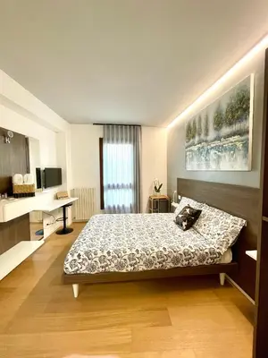 Letto o letti in una camera di Locatelli Apartments - Patio Living 