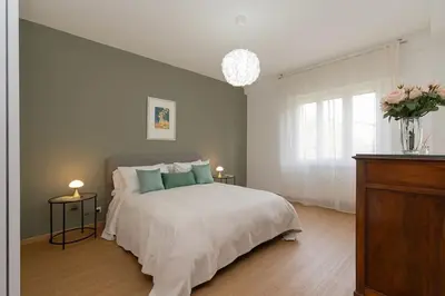 Letto o letti in una camera di enJoy Home - Appartamento signorile con vista