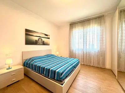 Letto o letti in una camera di Napoleone - Carraro Immobiliare - Family Apartments