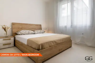 Letto o letti in una camera di GIGI HOUSE -appartamento PIAZZA MAZZINI- 200m dal mare