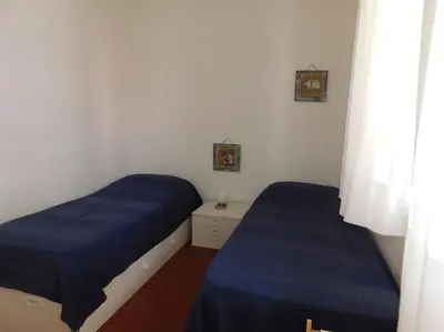 Letto o letti in una camera di Appartamento fronte mare Jesolo Lido