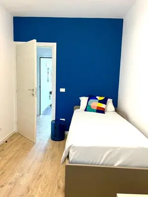 Letto o letti in una camera di LA ROSA DEL SILE
