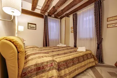 Letto o letti in una camera di Casa Angeli L.T. M0270422137