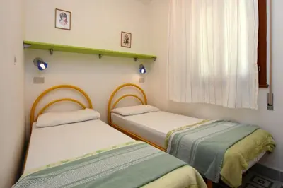 Letto o letti in una camera di Villa Chiara