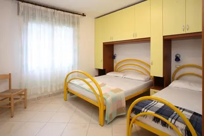 Letto o letti in una camera di Villa Medea