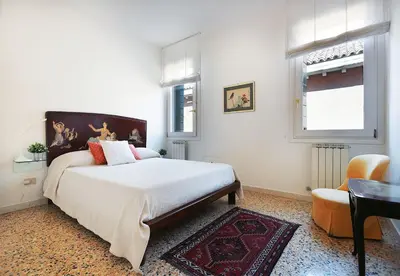 Letto o letti in una camera di GuestHost - Casa del Mandolino - Cozy Apt near the Station!