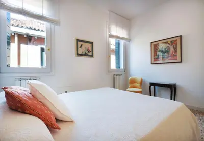 Letto o letti in una camera di GuestHost - Casa del Mandolino - Cozy Apt near the Station!