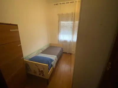 Letto o letti in una camera di Casa Tranquilla vicino al Centro