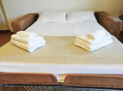 Letto o letti in una camera di CASA OLIVIA Private garden & Parking