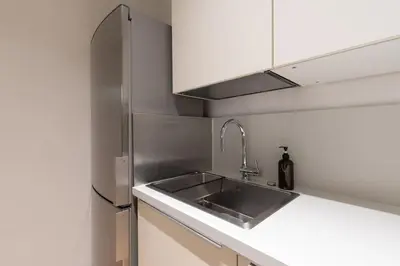 Cucina o angolo cottura di enJoy Home - Downtown Nest in Piazza Garibaldi