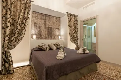 Letto o letti in una camera di San Marco NEW luxury Muneghe