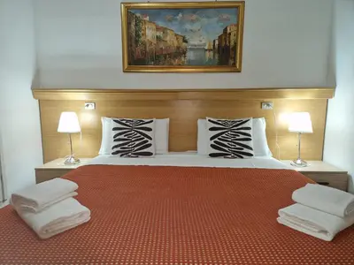 Letto o letti in una camera di Hotel Tito