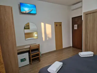 Letto o letti in una camera di Hotel Tito