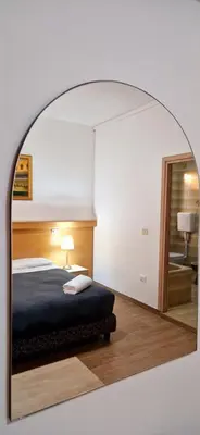 Letto o letti in una camera di Hotel Tito