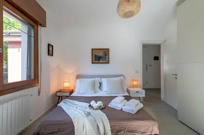 Letto o letti in una camera di Cappuccina Rooms nel cuore di Mestre