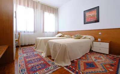 Letto o letti in una camera di Le Luise