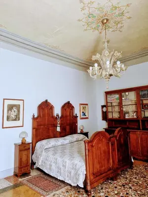 Letto o letti in una camera di Villa Nani Mocenigo, Golin