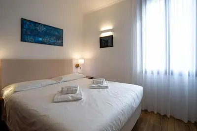 Letto o letti in una camera di Alloggi Marinella