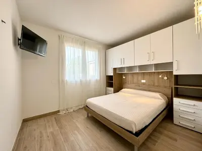 Letto o letti in una camera di Residence Eva - Carraro Immobiliare - Family Apartments