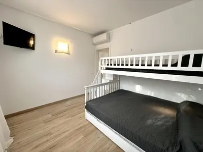 Letto o letti in una camera di Residence Eva - Carraro Immobiliare - Family Apartments