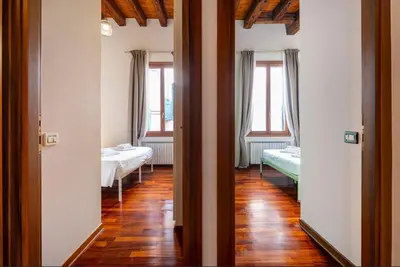 Letto o letti in una camera di San Marco Canal View by Bricola Apartments
