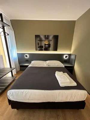 Letto o letti in una camera di Levelup