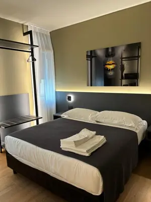 Letto o letti in una camera di Levelup
