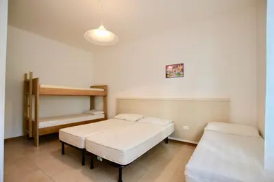 Letto o letti in una camera di Condominio Flaminia