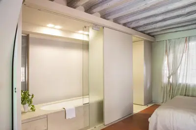 Letto o letti in una camera di Rio Barnaba Giardino - LOCAPPART