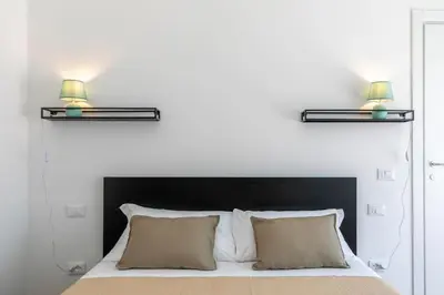 Letto o letti in una camera di Ca' Dandy Small by WelcHome