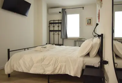 Letto o letti in una camera di Welc-ōM Padova Panta Rei rooms