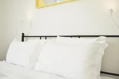 Letto o letti in una camera di Welc-ōM Padova Panta Rei rooms