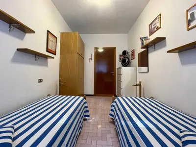 Letto o letti in una camera di Appartamento VILLA ALBA nel cuore della Pineta