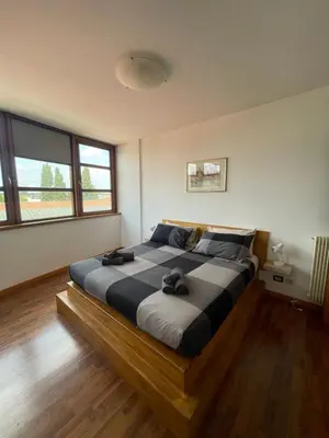 Letto o letti in una camera di Fonderia's Home - Parcheggia Senza Pensieri!