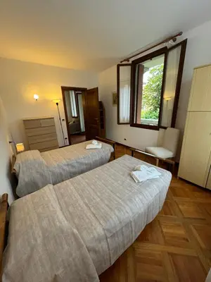 Letto o letti in una camera di Appartamento Villa Trento