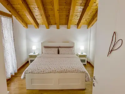 Letto o letti in una camera di Casa Maddalena