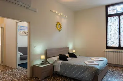 Letto o letti in una camera di Ca' Trapolin Venezia WIFI center city 520