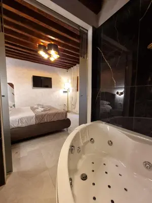 Letto o letti in una camera di San Marco 3097 - LuxuryJacuzzi