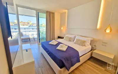 Letto o letti in una camera di HT - Luxury apartment at Palm Beach Jesolo