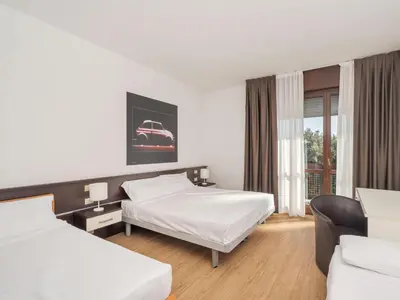 Letto o letti in una camera di B&B HOTEL Eurorest Conegliano