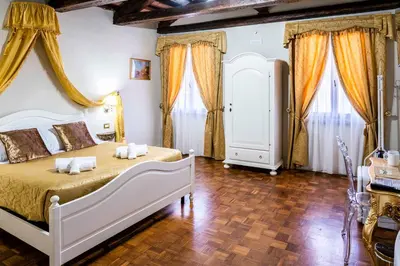 Letto o letti in una camera di Palazzo Titti Rialto Suites
