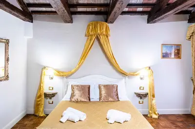 Letto o letti in una camera di Palazzo Titti Rialto Suites