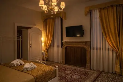 Letto o letti in una camera di Palazzo Titti Rialto Suites
