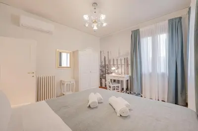 Letto o letti in una camera di Santo Stefano Palace