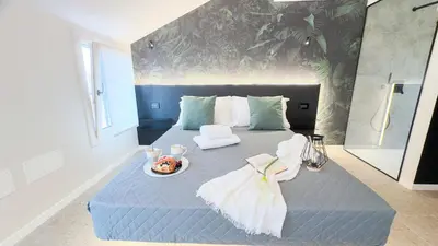 Letto o letti in una camera di Graceful Apartments Hell Apartment by Ca-Sa Check