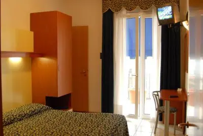 Letto o letti in una camera di Hotel Lido