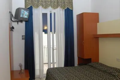 Letto o letti in una camera di Hotel Lido