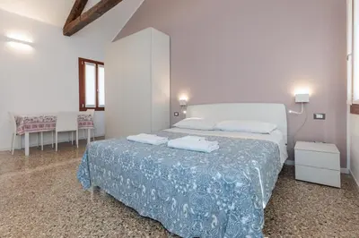 Letto o letti in una camera di Accogliente Monolocale Veneziano2 Aria Condizionata, vicino a campus e stazione